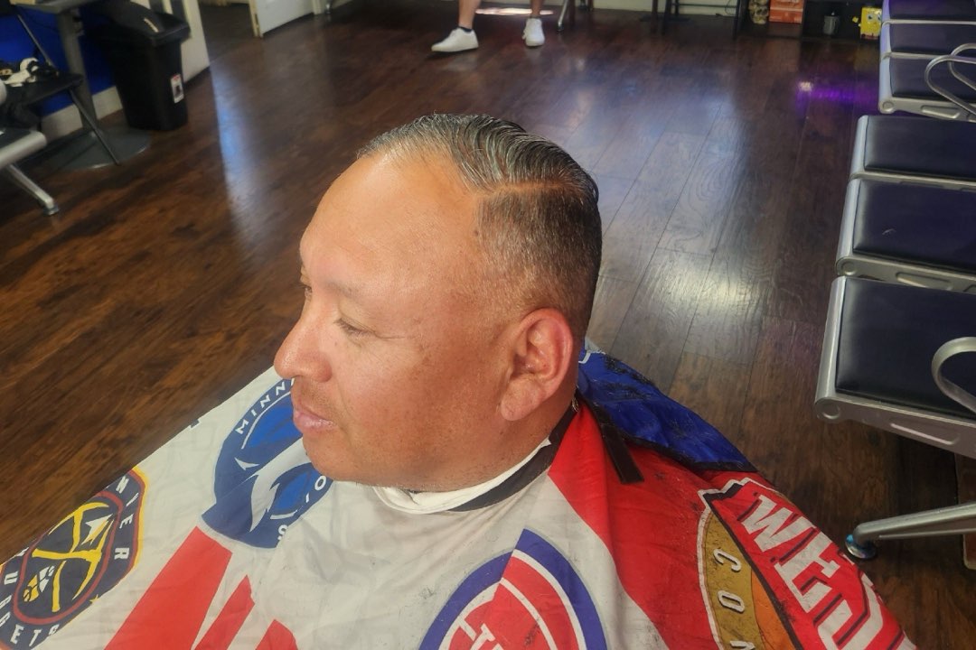 Men's side-part slick-back haircut at Sees Barbershop in Concord, CA