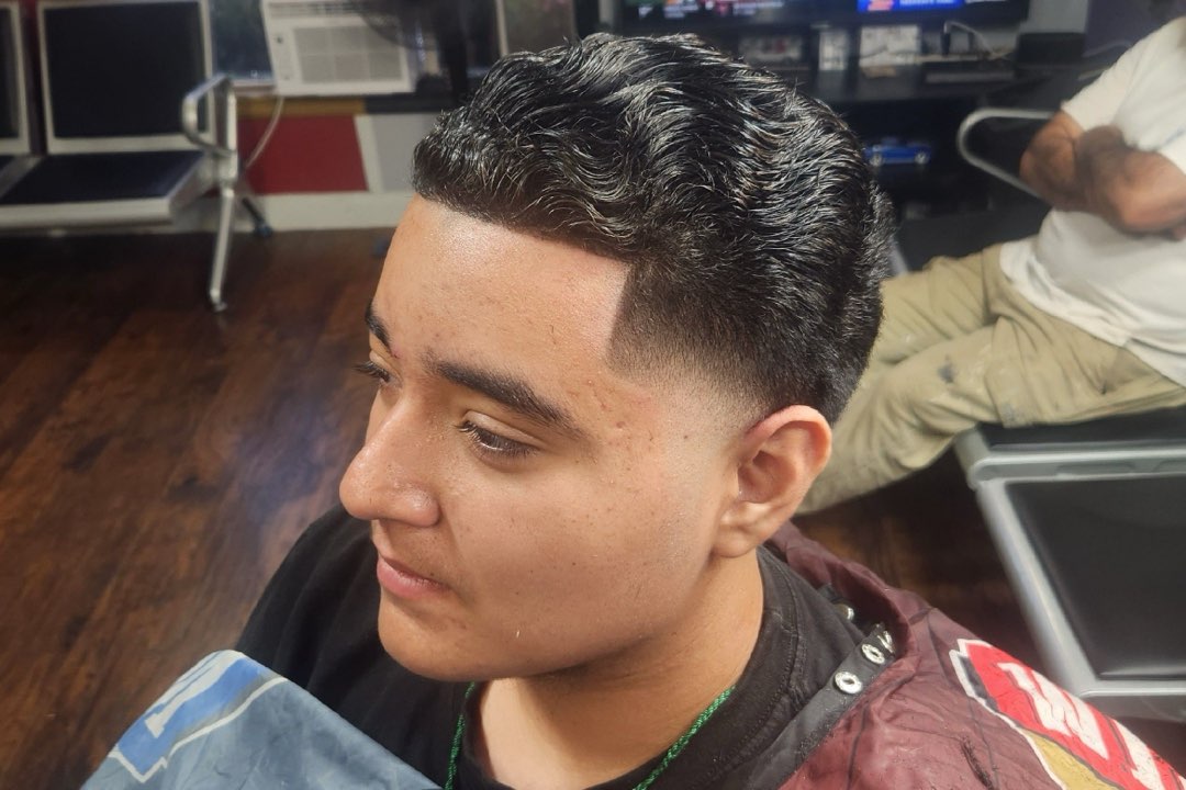 Men's textured quiff with a low fade and line-up at Sees Barbershop, Concord, CA