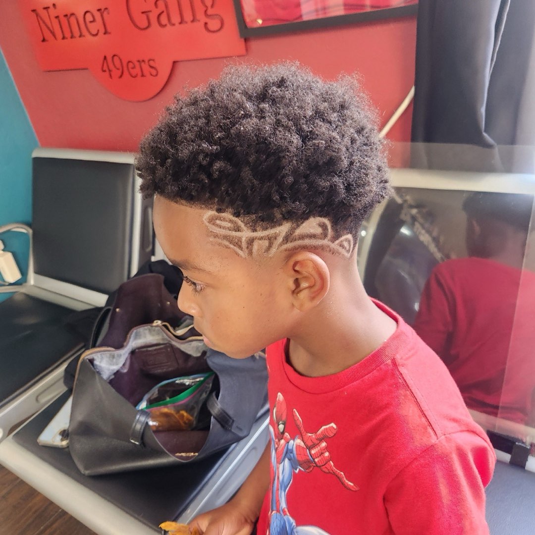 Kid's haircut with a shaved side design at Sees Barbershop, Concord, CA